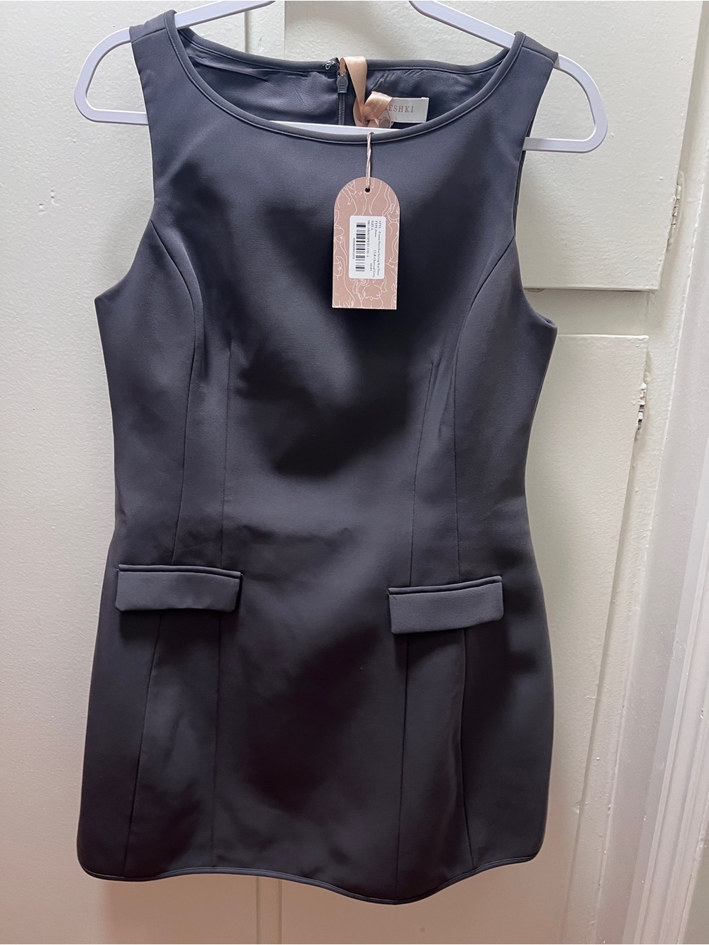 Meshki Black Sleeveless Sheath Dress with Pocket Flaps